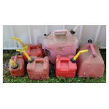 6 various size gas cans.