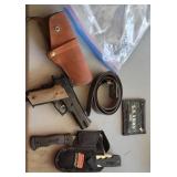 Daisy bb pistol, holster, Coleman hatchet/knife.