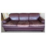 Leather sofa, worn but very comfortable.