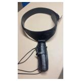 Black tooled leather belt with holster for a 22