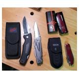 Schrade, buck and 2 swiss army knives.