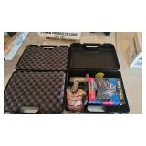 2 plastic cases and paintball gun