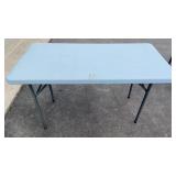 Foldable table with blue top
