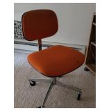 Retro Orange office chair needs tinkering and