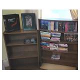 2 bookshelves, cassette tapes, and VHS movies all