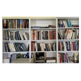 3 sections of hanging shelves full of books -