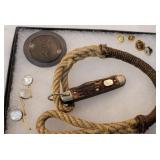 Boy scout knife, pins, and metal plate off of