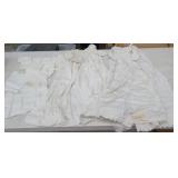 Estate christening gowns and baby shirts with