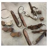 Box of vintage roller skates, ice skates and