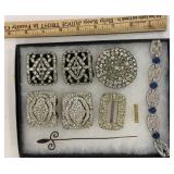 Lot of sparkly shoe clips, hat pin, bracelet and