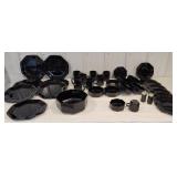 Set of black glass dinnerware