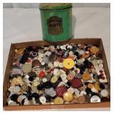 Tin of buttons in box