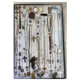 Collection of rosary beads & religious pendants