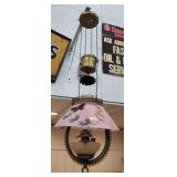 Weight driven oil lamp