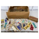 Big box of Matchbooks and cigarette tubes with