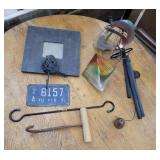 Wind chimes, license plate, hay hook, mirror