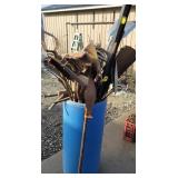 Bin of garden tools, shovels, pick, level,etc
