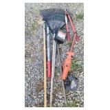 Rakes, hoe, fence charger, loppers