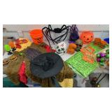 Box of Halloween decor, costumes etc