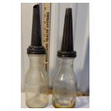 2 vintage oil bottles