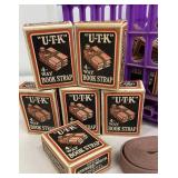 Small purple crate of "U-T-K" 4-way book straps -