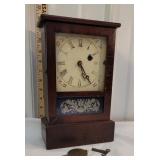 Ansonia shelf clock with key and pendulum
