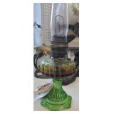 Green Aladdin oil lamp with original chimney and