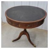 Early round 4 drawer leather top drum table