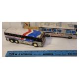 2 Greyhound toy buses- 1 is Buddy L