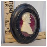 Carved bust of Abraham Lincoln in bowed diorama