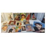 Box of magazines and Tom Selleck poster