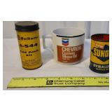Sunoco tin, Napa tire repair kit, and Chevron Oil