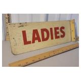 Flange sign for ladies bathroom