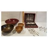 Four wooden bowls,  silverware in case,