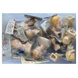 Small blue tub of doll heads