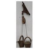 2 wooden buckets on pulley with wooden bracket