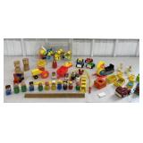 Clear bin of Fisher Price accessories & people