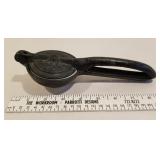 Cast iron juicer w/orig porcelain insert