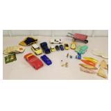 Cars, cards, parts of boats, metal wheel barrow,