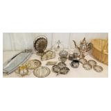 Wicker basket of silver plate items, ashtrays,