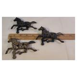 3 cast iron horses