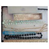 6 necklaces - I believe they are all glass