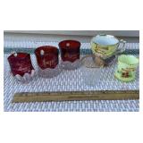 Box of souvenir glasses including The World