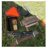 Jigs, power washer hose, slow moving vehicle sign