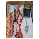 4 glass? Necklaces (1 signed Austria)
