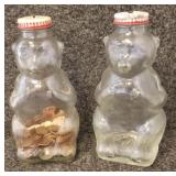 2 glass bear bottle banks, with contents