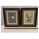 Pair of framed floral needlepoints - 1 frame is