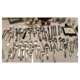 Assorted silverware, salt and peppers, cast iron