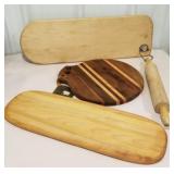 Wooden lot of cutting boards and rolling pin