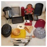 Lot of kitchenware, bread pans, cutting boards,